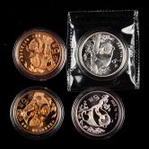 1993年中国珍稀野生动物-大熊猫流通纪念币二枚、1993年、1995年熊猫1/2盎司普制银币各一枚，共四枚