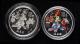 1997年迎春圖-宮燈1盎司普製銀幣、1999年迎春圖1盎司精製彩銀幣各一枚，共二枚
